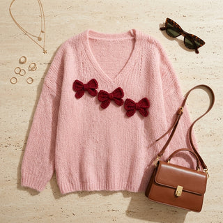 Kotori - Flat lay pull rose à nœuds et accessoires